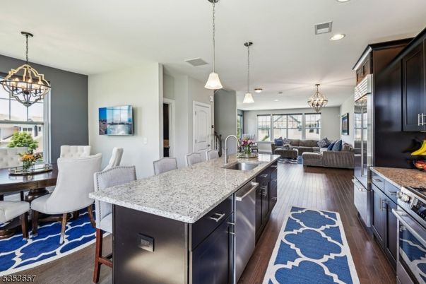 Chandelier, Dining room, Interior, Kitchen, Living room, Pendant Lights, Recessed Lighting, Wood Texture Flooring
