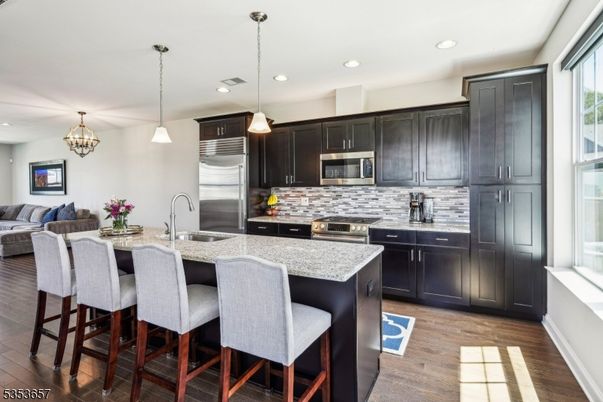 Chandelier, Interior, Kitchen, Pendant Lights, Recessed Lighting, Stainless Steel Appliances, Wood Texture Flooring