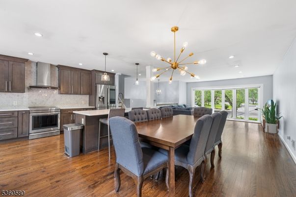 Dining room, Interior, Kitchen, Pendant Lights, Recessed Lighting, Stainless Steel Appliances, Wood Texture Flooring