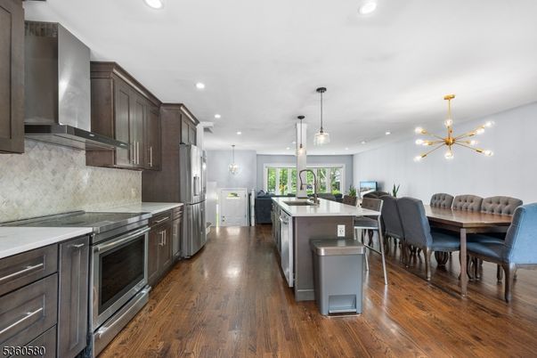Dining room, Interior, Kitchen, Pendant Lights, Recessed Lighting, Stainless Steel Appliances, Wood Texture Flooring