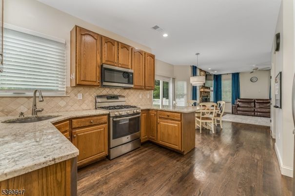 Dining room, Interior, Kitchen, Living room, Pendant Lights, Recessed Lighting, Stainless Steel Appliances, Wood Texture Flooring