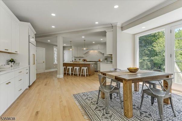 Dining room, Interior, Kitchen, Pendant Lights, Recessed Lighting, Stainless Steel Appliances, Wood Texture Flooring