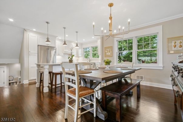 Chandelier, Dining room, Interior, Kitchen, Pendant Lights, Recessed Lighting, Stainless Steel Appliances, Wood Texture Flooring