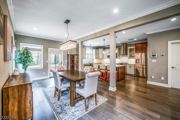 Chandelier, Dining room, Interior, Kitchen, Pendant Lights, Recessed Lighting, Stainless Steel Appliances, Wood Texture Flooring