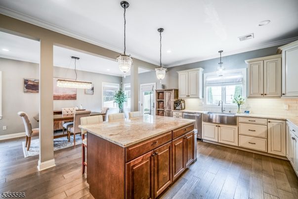 Chandelier, Dining room, Interior, Kitchen, Pendant Lights, Recessed Lighting, Stainless Steel Appliances, Wood Texture Flooring