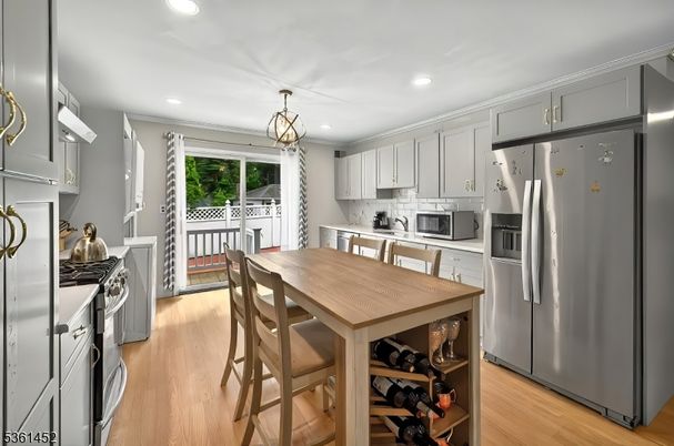 Dining room, Interior, Kitchen, Pendant Lights, Recessed Lighting, Stainless Steel Appliances, Wood Texture Flooring