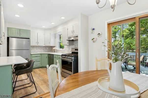 Dining room, Interior, Kitchen, Recessed Lighting, Stainless Steel Appliances, Wood Texture Flooring