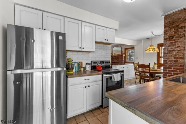 Dining room, Interior, Kitchen, Pendant Lights, Stainless Steel Appliances, Stone Walls