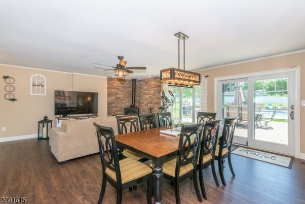 Dining room, Fireplace, Interior, Pendant Lights, Stone Walls, Wood Texture Flooring