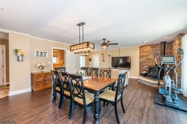 Dining room, Fireplace, Fitness Equipment, Interior, Pendant Lights, Stone Walls, Wood Texture Flooring