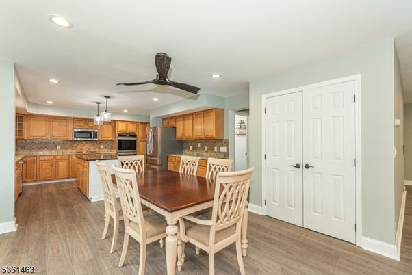 Dining room, Interior, Kitchen, Recessed Lighting, Stainless Steel Appliances, Wood Texture Flooring