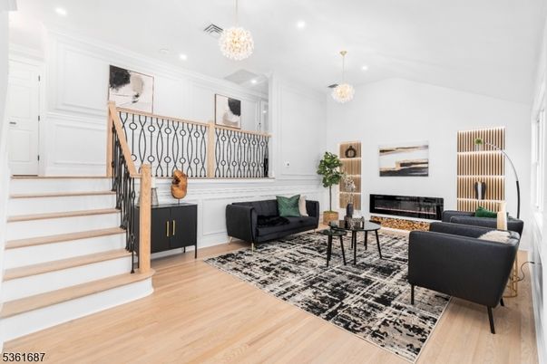 Chandelier, Fireplace, Interior, Living room, Recessed Lighting, Wood Texture Flooring