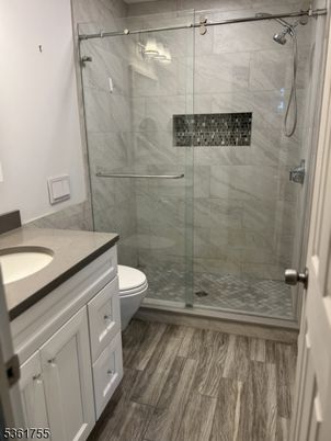 Bathroom, Glass Shower, Interior, Marble Walls, Wood Texture Flooring
