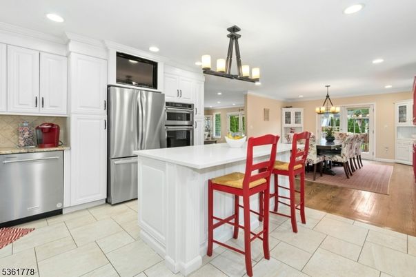 Chandelier, Dining room, Interior, Kitchen, Recessed Lighting, Stainless Steel Appliances, Wood Texture Flooring