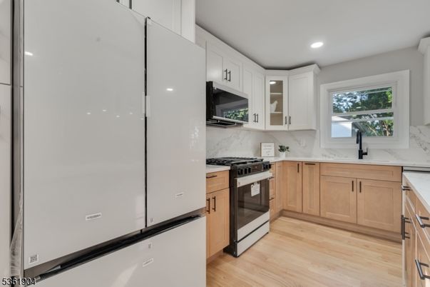 Interior, Kitchen, Marble Walls, Recessed Lighting, Stainless Steel Appliances, Wood Texture Flooring