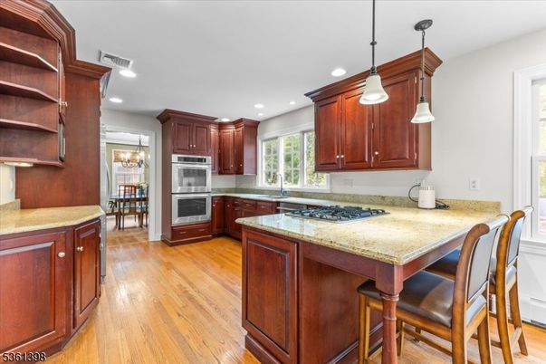 Chandelier, Dining room, Interior, Kitchen, Pendant Lights, Recessed Lighting, Stainless Steel Appliances, Wood Texture Flooring