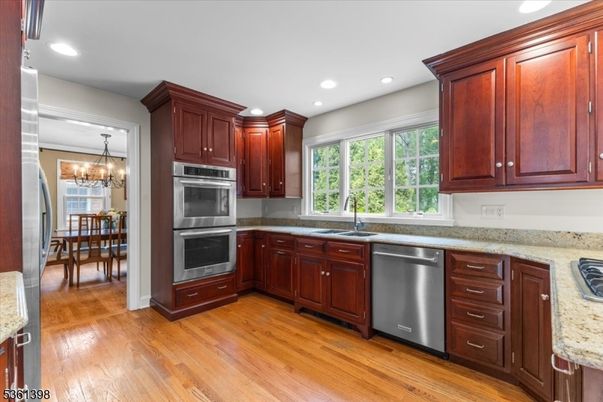 Chandelier, Dining room, Interior, Kitchen, Recessed Lighting, Stainless Steel Appliances, Wood Texture Flooring