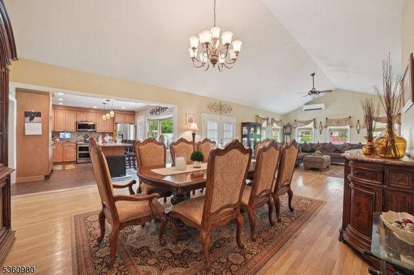 Chandelier, Dining room, Interior, Kitchen, Living room, Pendant Lights, Stainless Steel Appliances, Wood Texture Flooring