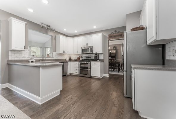 Dining room, Interior, Kitchen, Recessed Lighting, Stainless Steel Appliances, Wood Texture Flooring