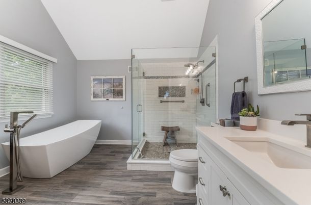 Bathroom, Dual Sink Vanities, Free Standing Baths, Glass Shower, Interior, Wood Texture Flooring