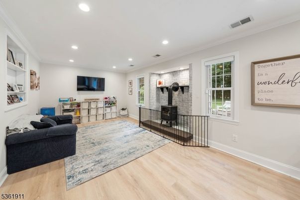 Fireplace, Interior, Living room, Recessed Lighting, Stone Walls, Wood Texture Flooring