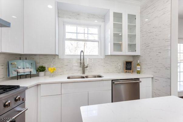 Interior, Kitchen, Marble Walls, Recessed Lighting, Stainless Steel Appliances