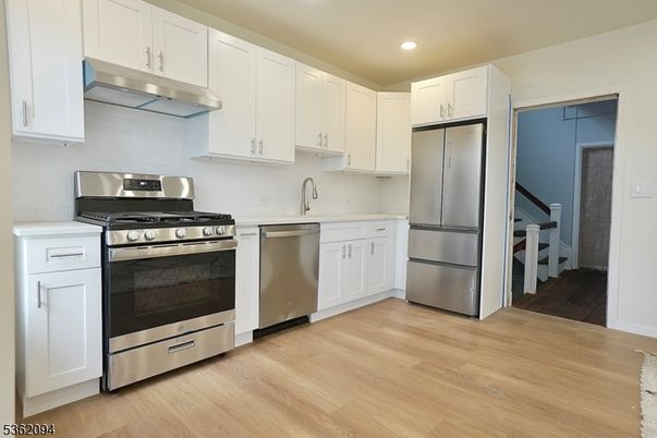 Interior, Kitchen, Recessed Lighting, Stainless Steel Appliances, Wood Texture Flooring