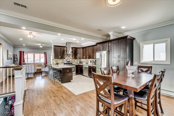 Dining room, Interior, Kitchen, Living room, Recessed Lighting, Stainless Steel Appliances, Wood Texture Flooring