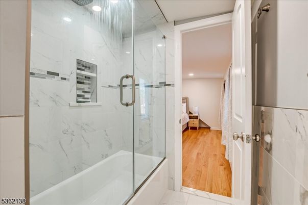 Bathroom, Glass Shower, Interior, Marble, Marble Walls, Recessed Lighting, Wood Texture Flooring