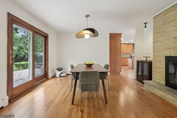 Dining room, Fireplace, Interior, Kitchen, Pendant Lights, Recessed Lighting, Stone Walls, Wood Texture Flooring