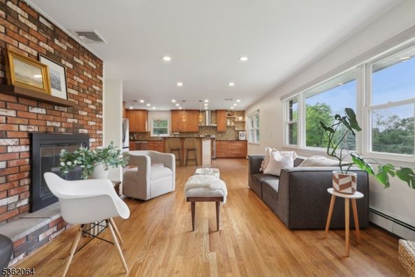 Fireplace, Interior, Kitchen, Living room, Pendant Lights, Recessed Lighting, Stone Walls, Wood Texture Flooring