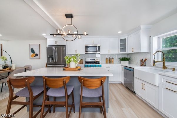 Chandelier, Interior, Kitchen, Pendant Lights, Recessed Lighting, Stainless Steel Appliances, Wood Texture Flooring