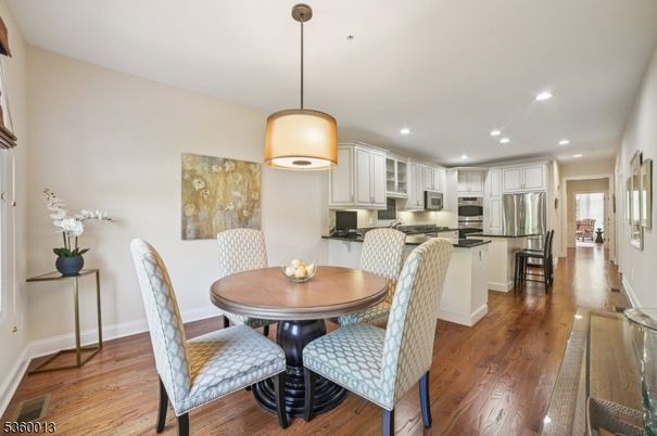 Dining room, Interior, Kitchen, Pendant Lights, Recessed Lighting, Stainless Steel Appliances, Wood Texture Flooring