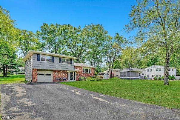 Attached, Backyard, Exterior, Facade, Brick Facade, Raised Ranch