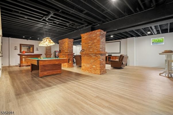 Billiard Table, Fireplace, Game Room, Interior, Pendant Lights, Recessed Lighting, Wood Texture Flooring