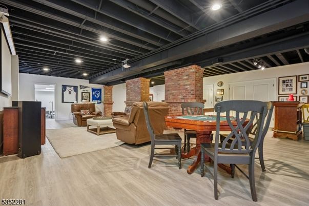Fireplace, Interior, Living room, Recessed Lighting, Stone Walls, Wood Texture Flooring