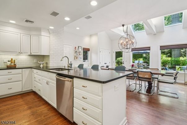 Chandelier, Dining room, Interior, Kitchen, Recessed Lighting, Stainless Steel Appliances, Wood Texture Flooring