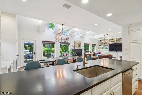 Chandelier, Dining room, Fireplace, Interior, Kitchen, Living room, Recessed Lighting, Wood Texture Flooring