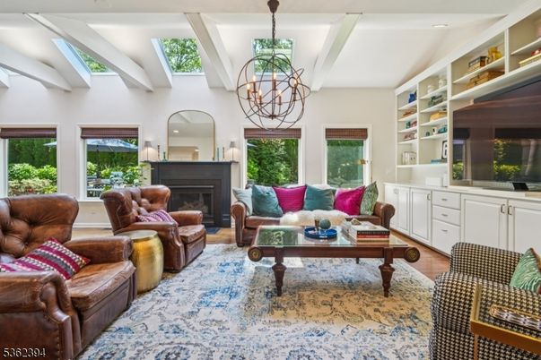 Chandelier, Fireplace, Interior, Living room, Recessed Lighting, Wood Texture Flooring