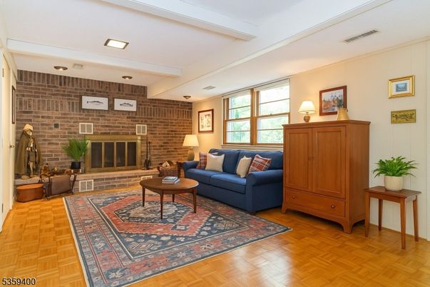 Fireplace, Interior, Living room, Recessed Lighting, Stone Walls, Wood Texture Flooring