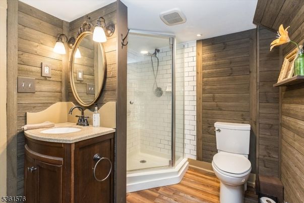 Bathroom, Glass Shower, Interior, Recessed Lighting, Wood Texture Flooring, Wooden Walls