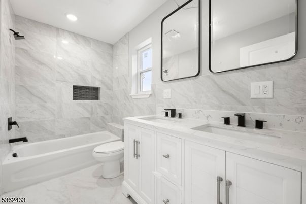 Bathroom, Dual Sink Vanities, Interior, Marble, Marble Walls, Recessed Lighting