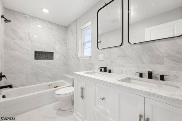 Bathroom, Dual Sink Vanities, Interior, Marble, Marble Walls, Recessed Lighting