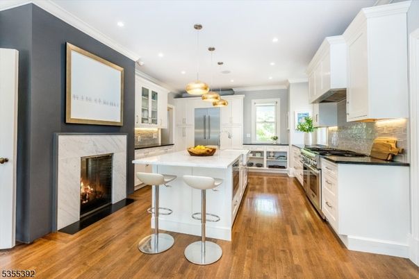 Fireplace, Interior, Kitchen, Pendant Lights, Recessed Lighting, Stainless Steel Appliances, Wood Texture Flooring