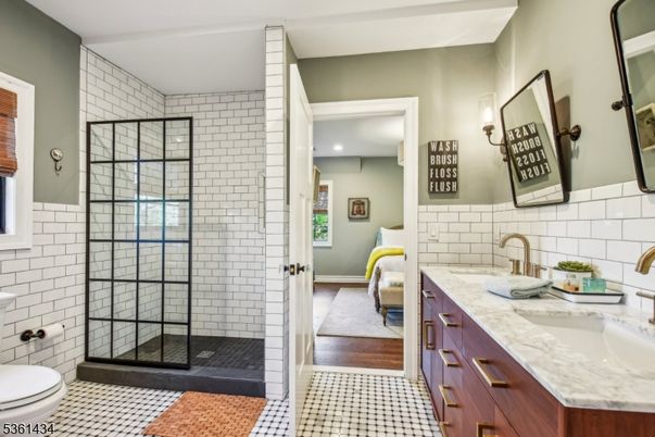 Bathroom, Dual Sink Vanities, Glass Shower, Interior, Recessed Lighting, Wood Texture Flooring