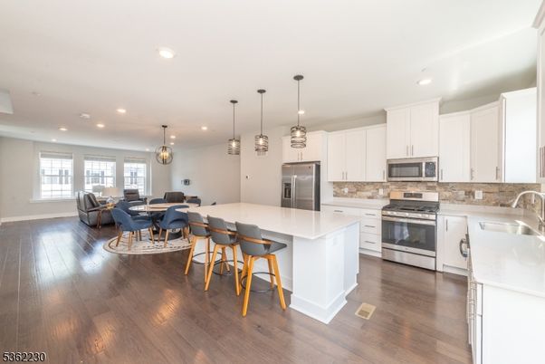 Dining room, Interior, Kitchen, Pendant Lights, Recessed Lighting, Stainless Steel Appliances, Wood Texture Flooring