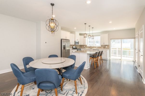Dining room, Interior, Kitchen, Pendant Lights, Recessed Lighting, Stainless Steel Appliances, Wood Texture Flooring