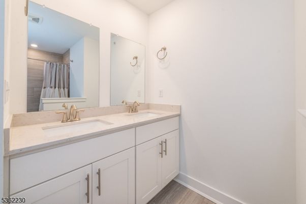 Bathroom, Dual Sink Vanities, Interior, Recessed Lighting, Wood Texture Flooring