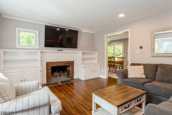 Dining room, Fireplace, Interior, Living room, Recessed Lighting, Wood Texture Flooring