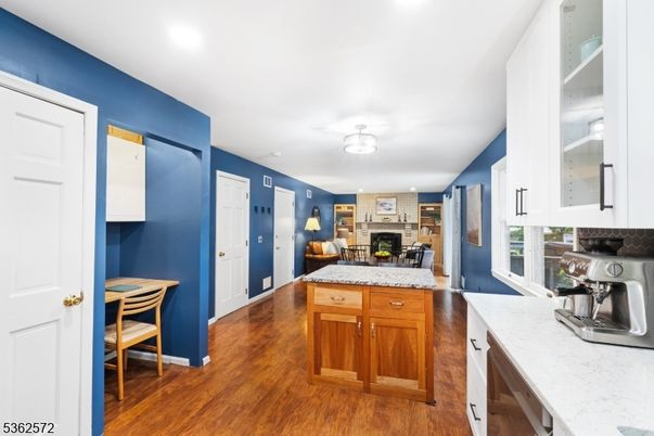 Dining room, Fireplace, Interior, Kitchen, Recessed Lighting, Wood Texture Flooring